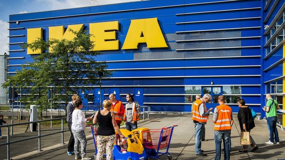 epa04354596 Activists from Dutch trade union FNV inform customers of IKEA about the alleged poor working conditions for the drivers of the retail in Haarlem, The Netherlands, 15 August 2014. The joint ...