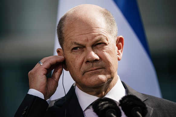 epa10179663 German Chancellor Olaf Scholz looks on next to Israeli Prime Minister Yair Lapid (not in the picture) during a joint press conference at the chancellery in Berlin, Germany, 12 September 20 ...