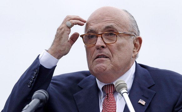 FILE - In this Aug. 1, 2018 file photo, Rudy Giuliani, attorney for President Donald Trump, addresses a gathering during a campaign event in Portsmouth, N.H. House committees have subpoena Giuliani fo ...