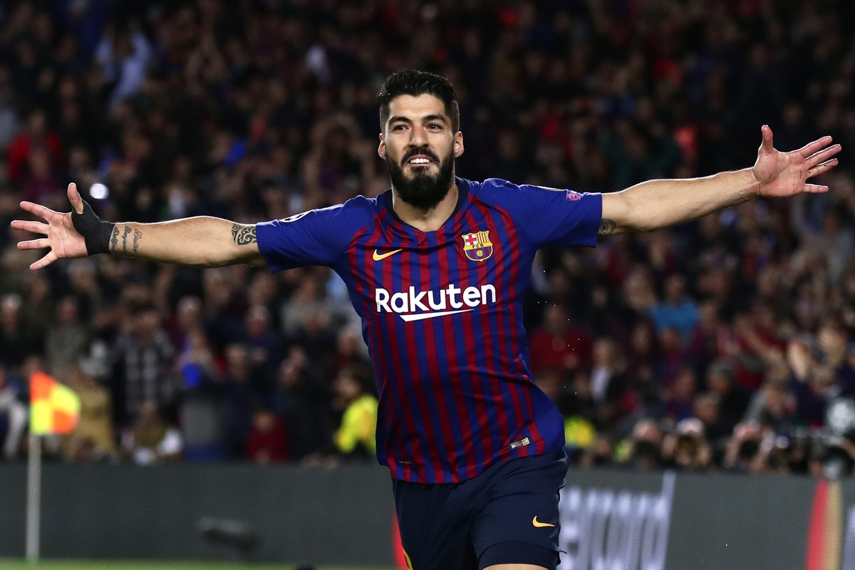 Barcelona's Luis Suarez celebrates scoring his side's first goal during the Champions League semifinal first leg soccer match between FC Barcelona and Liverpool at the Camp Nou stadium in Ba ...