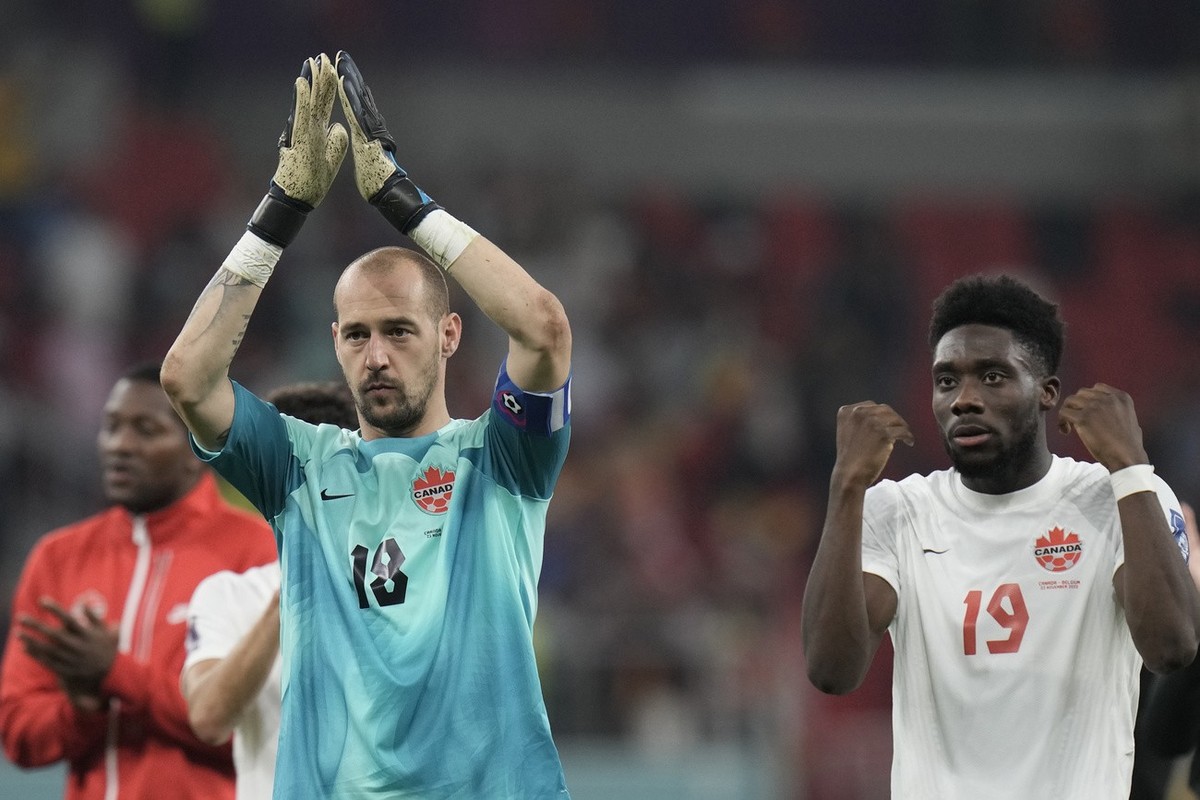 Canada's goalkeeper Milan Borjan, left, and Canada's Alphonso Davies react disappointed after the World Cup group F soccer match between Belgium and Canada, at the Ahmad Bin Ali Stadium in D ...
