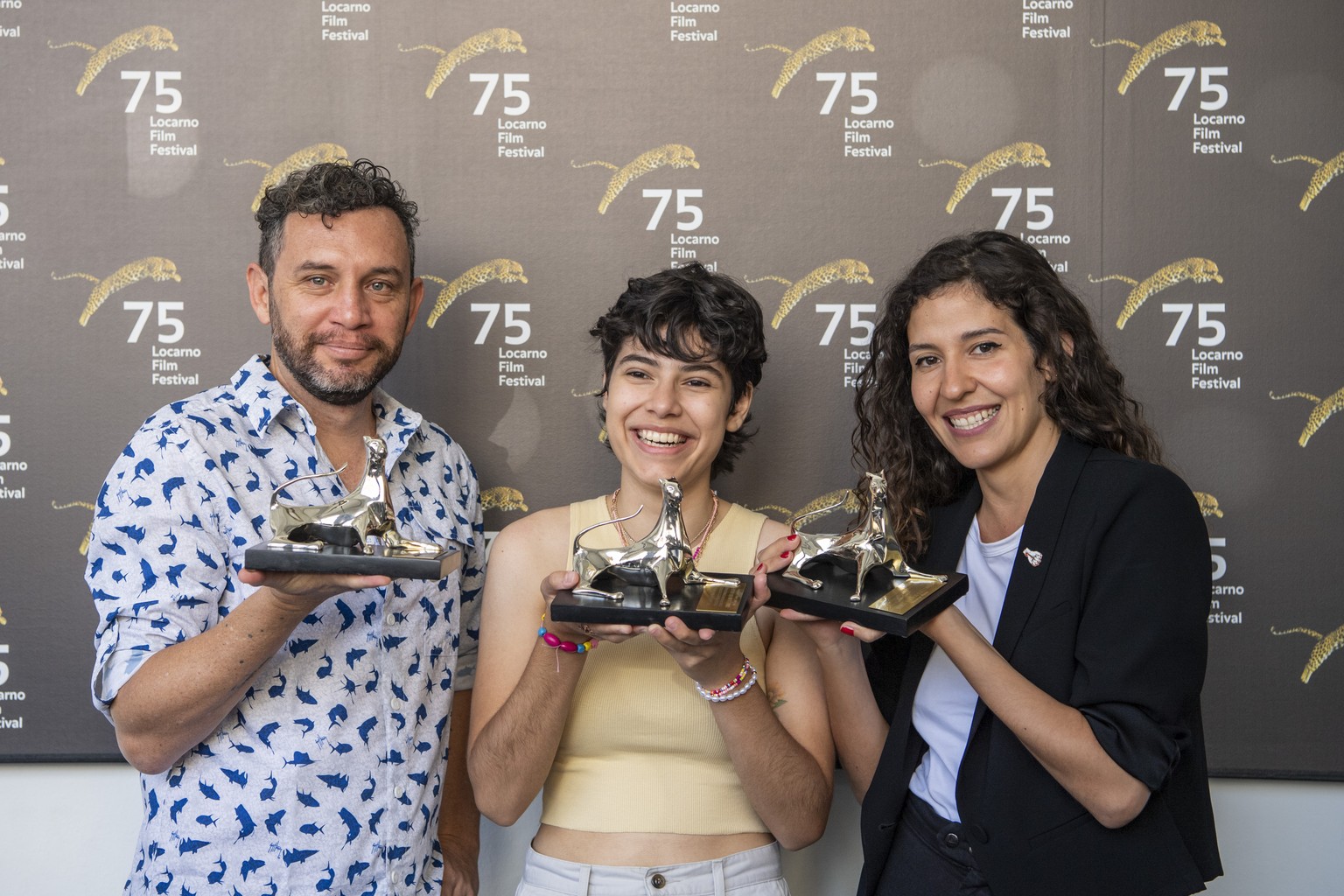 Actor Reinaldo Amien Gutierrez posing with the Pardo for best Actor Award, Actress Daniela Marin Navarro posing with the Pardo for best Actress and Film Director Valentino Maurel posing with the Pardo ...