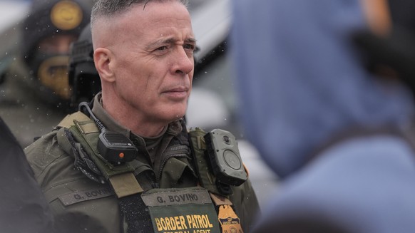 U.S. Border Patrol Cmdr. Gregory Bovino stands with Federal agents outside a convenience store on Wednesday, Jan. 21, 2026, in Minneapolis. (AP Photo/Angelina Katsanis)
Immigration Enforcement Minneso ...