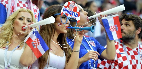 epa06881183 Supporters of Croatia cheer prior to the FIFA World Cup 2018 semi final soccer match between Croatia and England in Moscow, Russia, 11 July 2018.

(RESTRICTIONS APPLY: Editorial Use Only, not used in association with any commercial entity - Images must not be used in any form of alert service or push service of any kind including via mobile alert services, downloads to mobile devices or MMS messaging - Images must appear as still images and must not emulate match action video footage - No alteration is made to, and no text or image is superimposed over, any published image which: (a) intentionally obscures or removes a sponsor identification image; or (b) adds or overlays the commercial identification of any third party which is not officially associated with the FIFA World Cup)  EPA/PETER POWELL   EDITORIAL USE ONLY