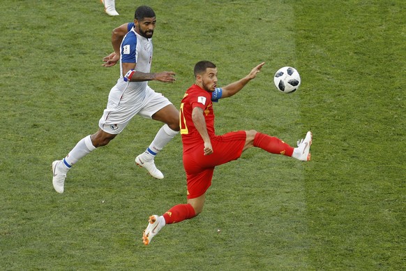Belgium&#039;s Eden Hazard, right, lunges for the ball against Panama&#039;s Gabriel Gomez during the group G match between Belgium and Panama at the 2018 soccer World Cup in the Fisht Stadium in Soch ...
