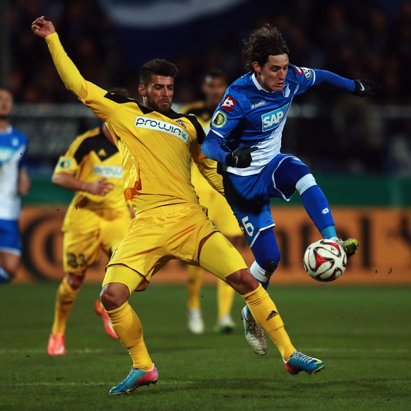 AALEN, GERMANY - MARCH 03: Juergen Gjasula (L) of Aalen is challenged by Sebastian Rudy of Hoffenheim during the DFB Cup Round of 16 match between VfR Aalen and 1899 Hoffenheim at Scholz Arena on Marc ...