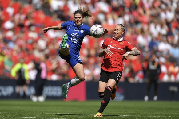 epa10627326 Maren Mjelde of Chelsea clears the ball as Leah Galton of Manchester United looks on during the Women&#039;s FA Cup final soccer match between Chelsea Women FC and Manchester United WFC in ...