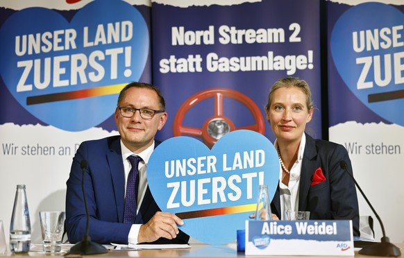 epa10169746 Alternative for Germany (AfD) right-wing political party co-chairman Tino Chrupalla (L) and deputy chairwoman Alice Weidel attend a news conference to present the new party campaign &#039; ...