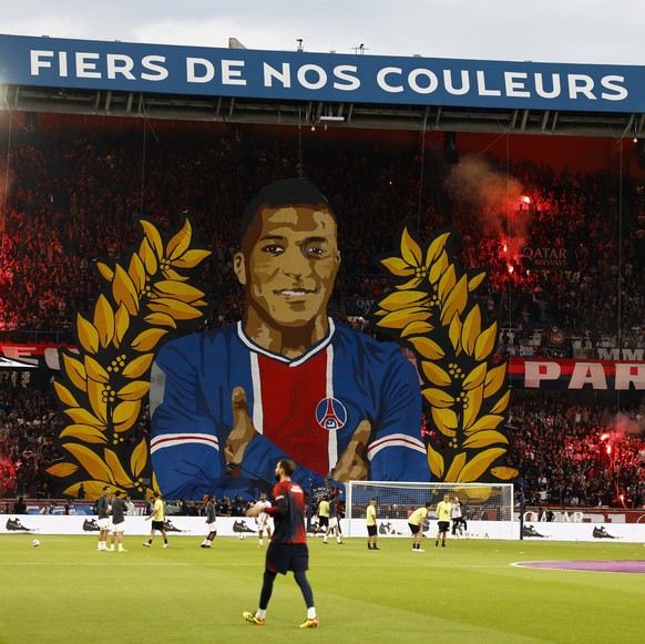 epa11336103 PSG fans display a tifo with a picture of Kylian Mbappe prior to the French Ligue 1 soccer match between Paris Saint-Germain (PSG) and Toulouse (TFC) in Paris, France, 12 May 2024. EPA/MOH ...