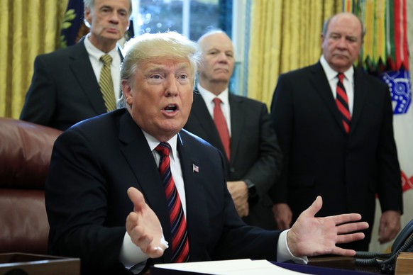 President Donald Trump speaks following a ceremony signing the &quot;America's Water Infrastructure Act of 2018&quot; into law in the Oval Office at the White House in Washington, Tuesday, Oct. 23, 20 ...
