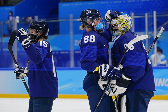 Finland goalkeeper Anni Keisala (36) is congratulated by Finland&#039;s Ronja Savolainen (88) after a win over Russian Olympic Committee during a preliminary round women&#039;s hockey game at the 2022 ...