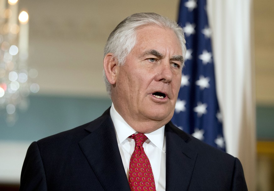 FILE - In a Friday, Oct. 13, 2017 file photo, Secretary of State Rex Tillerson answers a reporters question while greeting Organization of American States Secretary-General Luis Almagro at the State D ...