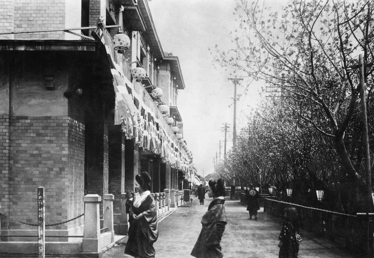 TOKYO, Japan - The file photo shows Yoshiwara, Japan's largest licensed red-light district until prostitution was banned in 1957, located in Tokyo. The Taisho-period (1912-1926) photo was taken b ...