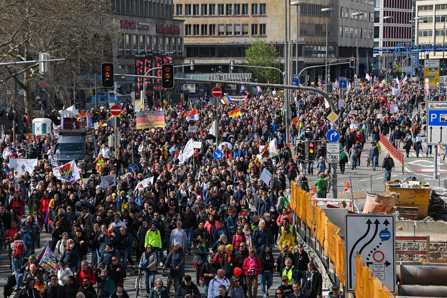 epa09113035 Protesters during a demonstration held by the ?Querdenker&#039; (lateral thinkers) movement against the German government&#039;s coronavirus restrictions in Stuttgart, Germany, 03 April 20 ...