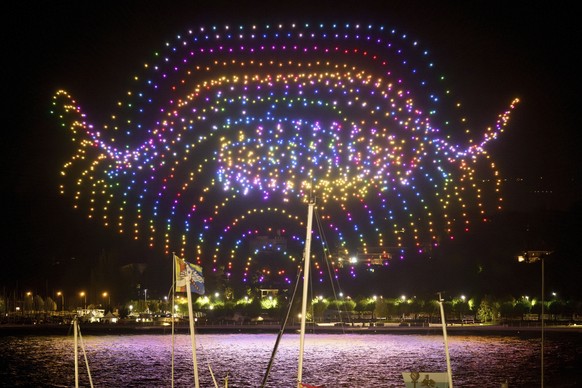 A drone night-time light show illuminates the night sky over the harbour area, in Geneva, Switzerland, Thursday, May 18, 2023. As a part of the four-day &quot;Feu O Lac&quot; events, more than 1350 dr ...