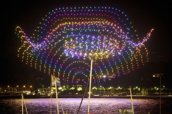 A drone night-time light show illuminates the night sky over the harbour area, in Geneva, Switzerland, Thursday, May 18, 2023. As a part of the four-day &quot;Feu O Lac&quot; events, more than 1350 dr ...