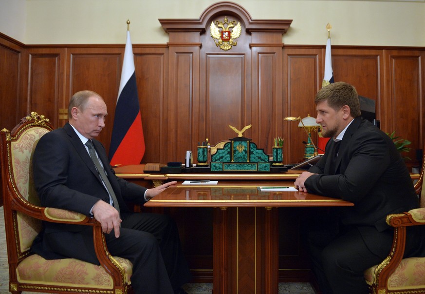 Russian President Vladimir Putin, left, meets with Chechnya&#039;s regional leader Ramzan Kadyrov in the Kremlin in Moscow, Russia, Thursday, Dec. 4, 2014. Putin praised Kadyrov for quickly destroying ...