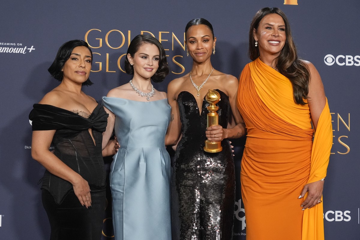 Adriana Paz, from left, Selena Gomez, Zoe Saldana, winner of the award for best performance by a female actor in a supporting role in any motion picture for "Emilia Perez," and Karla Sofia G ...