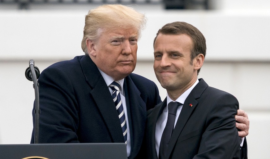 President Donald Trump and French President Emmanuel Macron shake hands during a State Arrival Ceremony on the South Lawn of the White House in Washington, Tuesday, April 24, 2018. (AP Photo/Andrew Ha ...