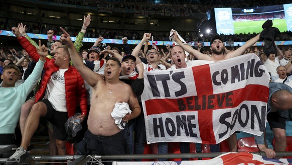 England fans celebrate their side&#039;s 2-1 win at the end of the Euro 2020 soccer championship semifinal match between England and Denmark at Wembley stadium in London, Wednesday, July 7, 2021. (AP  ...