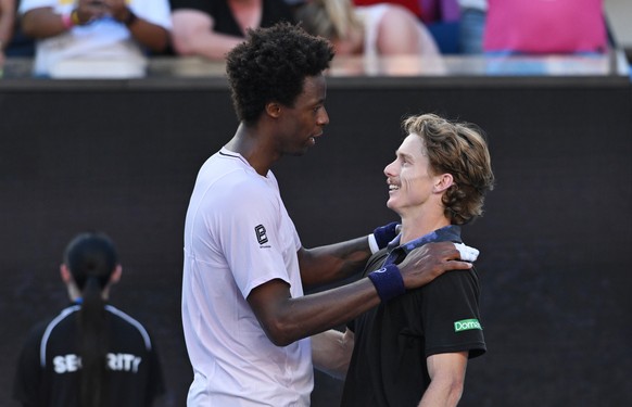 epa12663059 Dane Sweeny of Australia (R) chats with Gael Monfils of France after winning their Mens Singles first round match at the Australian Open tennnis tournament in Melbourne, Australia, 20 Jan ...