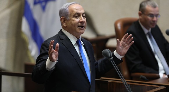 epa09267702 Israeli prime minister Benjamin Netanyahu speaks during a special voting session on the formation of a new coalition government at the Knesset Plenum, at the Knesset, Israeli parliament, i ...
