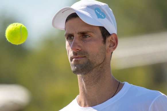 epa09291274 Serbian Novak Djokovic attends a training session with Austrian Dominic Thiem during the Mallorca Championship ATP 250 held at Country Club in Santa Ponsa, Mallorca, Balearic Islands, Spai ...