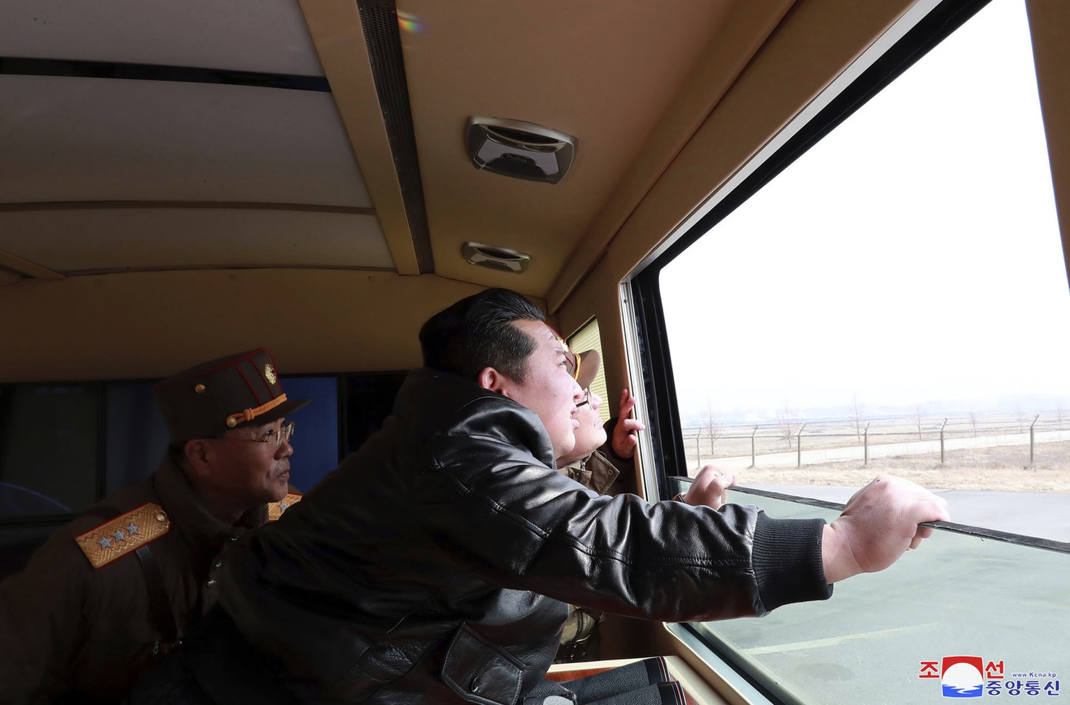 In this photo distributed by the North Korean government, North Korean leader Kim Jong Un watches what it says a test-fire of a Hwasong-17 intercontinental ballistic missile (ICBM), at an undisclosed  ...