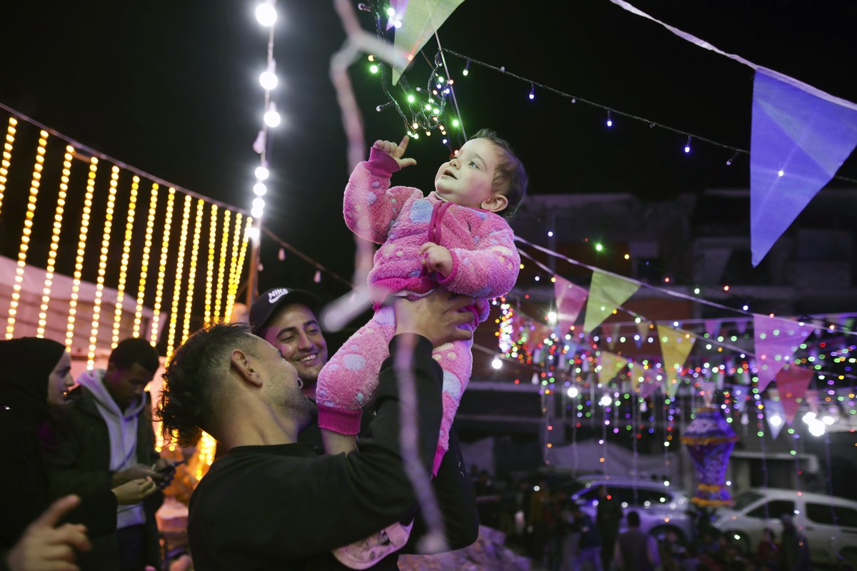 Festive lights are strung between destroyed Palestinian homes for the holy month of Ramadan in Khan Younis, southern Gaza Strip, Friday, Feb. 28, 2025. (AP Photo/Jehad Alshrafi)
Mideast Ramadan Photo  ...