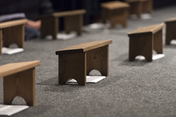 epa06408314 Footstools on the stage are ready for an evening prayer during the fortieth annual international young adults meeting of the ecumenical Christian monastic order of the Taize Community, in  ...