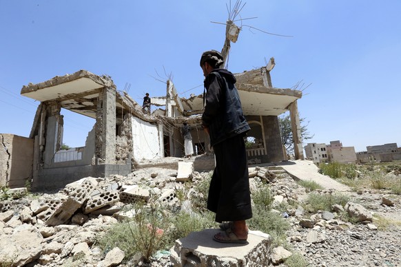 epa07854285 Men inspect debris of a destroyed house allegedly hit by a previous Saudi-led airstrike in Sana&#039;a, Yemen, 19 September 2019. Yemen has been in the grip of a devastating power struggle ...