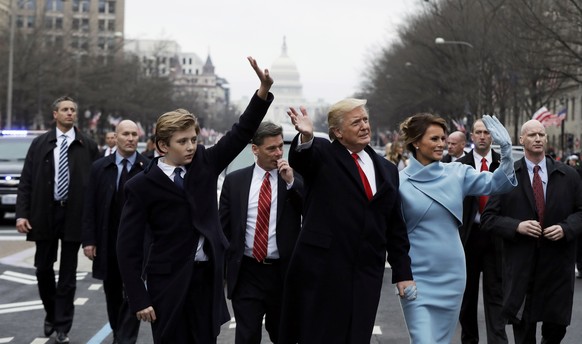 U.S. President Donald Trump, first lady Melania Trump and son Barron walk during the inaugural parade from the U.S. Capitol in Washington, U.S., January 20, 2017. REUTERS/Pool