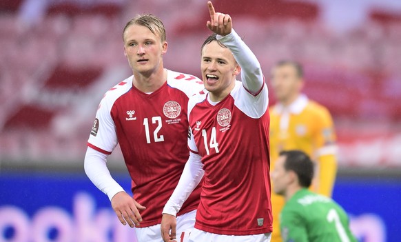 epa09103370 Denmark's Mikkel Damsgaard (R) celebrates with team-mate with team mate Kasper Dolberg after scoring a goal during the FIFA World Cup 2022 qualifiers match between Denmark and Moldova ...