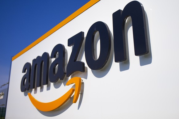 FILE - In this Thursday April 16, 2020 file photo, The Amazon logo is seen in Douai, northern France. Amazon is suing the attorney general of New York in a bid to stop her from suing the company over  ...