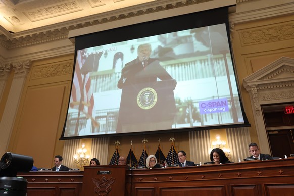 epa10067576 A video of former US President Donald J. Trump delivering a speech on 06 January 2020 appears on screen as members of the Oath Keepers appears on a screen a public hearing of the House Sel ...