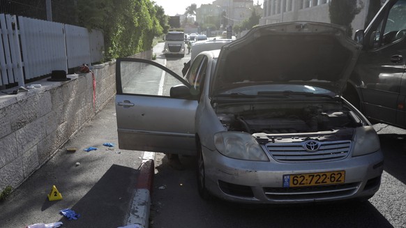 epa10577885 The site of an attack in the Sheikh Jarrah neighborhood of East Jerusalem, April 18, 2023. According to police, two Orthodox Jews were shot and wounded in their vehicle by a Palestinian shooting...
