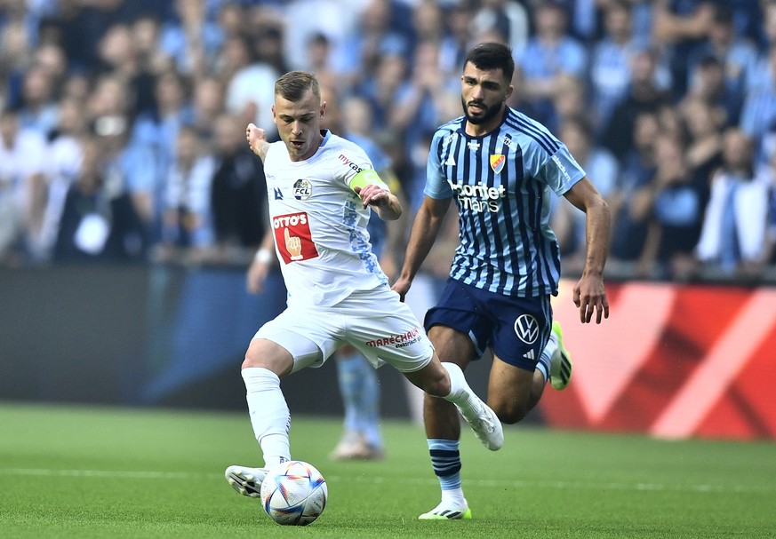 epa10772010 Luzern&#039;s (L) Max Meyer and Djurgarden&#039;s Musa Gurbanli in action during the UEFA Europa Conference League, second qualifying round first leg match, between Djurgardens IF and FC L ...