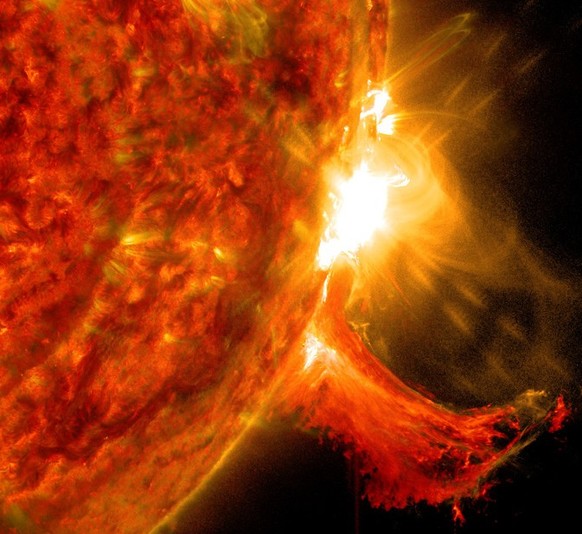 NASA&#039;s Solar Dynamics Observatory captured this image of a solar flare on Oct. 2, 2014. The solar flare is the bright flash of light on the right limb of the sun. A burst of solar material erupti ...