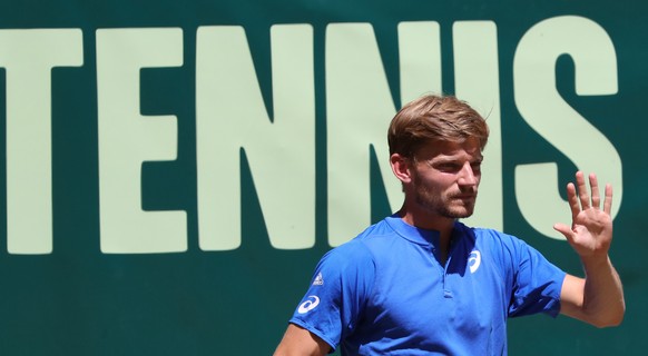 epa07667833 David Goffin from Belgium in action against Roger Federer from Switzerland during their final match at the ATP Tennis Tournament Noventi Open (former Gerry Weber Open) in Halle Westphalia, ...