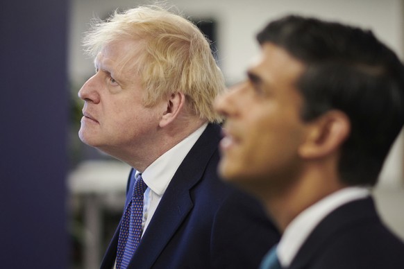 FILE - Britain&#039;s Prime Minister Boris Johnson, left, and Chancellor of the Exchequer Rishi Sunak visit the headquarters of Octopus Energy in London, Monday Oct. 5, 2020. Sunak ran for Britain