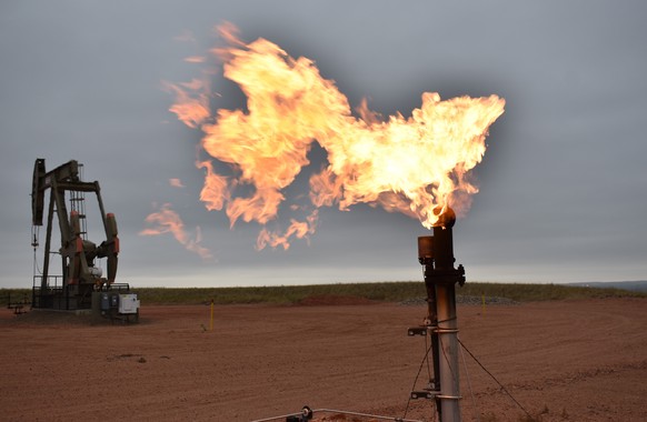 FILE - In this Aug. 26, 2021 file photo, a flare burns natural gas at an oil well Aug. 26, 2021, in Watford City, N.D. The world&#039;s facing an energy crunch. Europe is feeling it worst as natural g ...