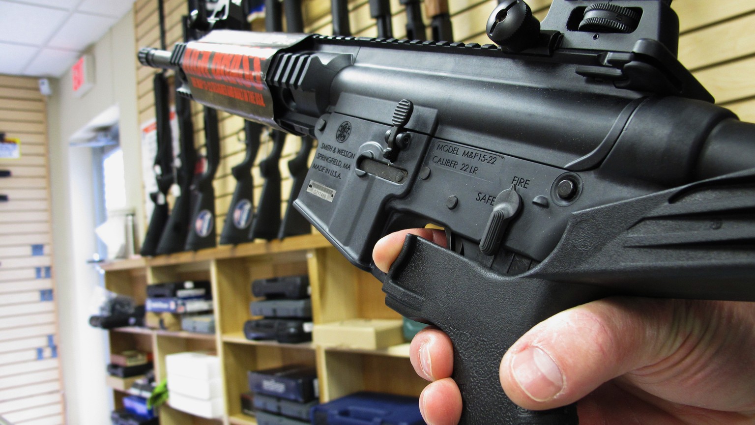 FILE - In this Feb. 1, 2013, file photo, an employee of North Raleigh Guns demonstrates how a &quot;bump&quot; stock works at the Raleigh, N.C., shop. The gunman who unleashed hundreds of rounds of gu ...