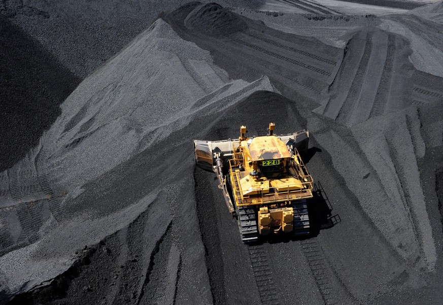 FEDERAL BUDGET 2014, Coal is stockpiled before being loaded on to ships at the RG Tanner Coal Terminal in Gladstone, Friday, Jan. 20, 2012. The Terminal plays a vital role in delivering coal supplies  ...