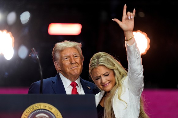 FILE - President Donald Trump stands with Erika Kirk at the conclusion of a memorial for her husband, conservative activist Charlie Kirk, in Glendale, Ariz., Sept. 21, 2025. (AP Photo/Julia Demaree Ni ...
