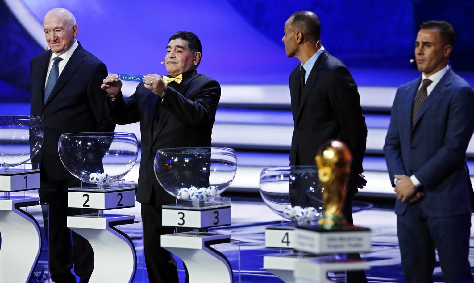 epa06361863 Draw assistants (L-R), former Soviet international Nikita Simonyan, former Argentine international Diego Maradona, former Brazilian international Cafu, and former Italian international Fab ...