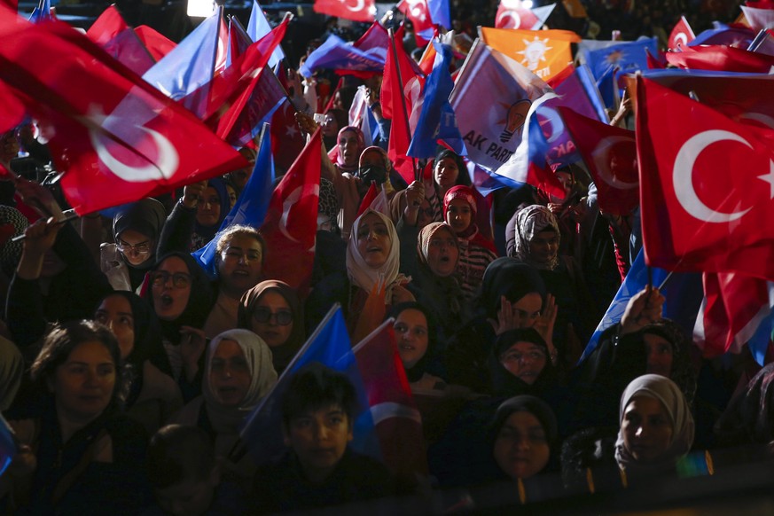 Supporters of Turkish President Recep Tayyip Erdogan cheer outside the party headquarters in Ankara, Turkey, Sunday, May 14, 2023. Erdogan, who has ruled his country with an increasingly firm grip for ...
