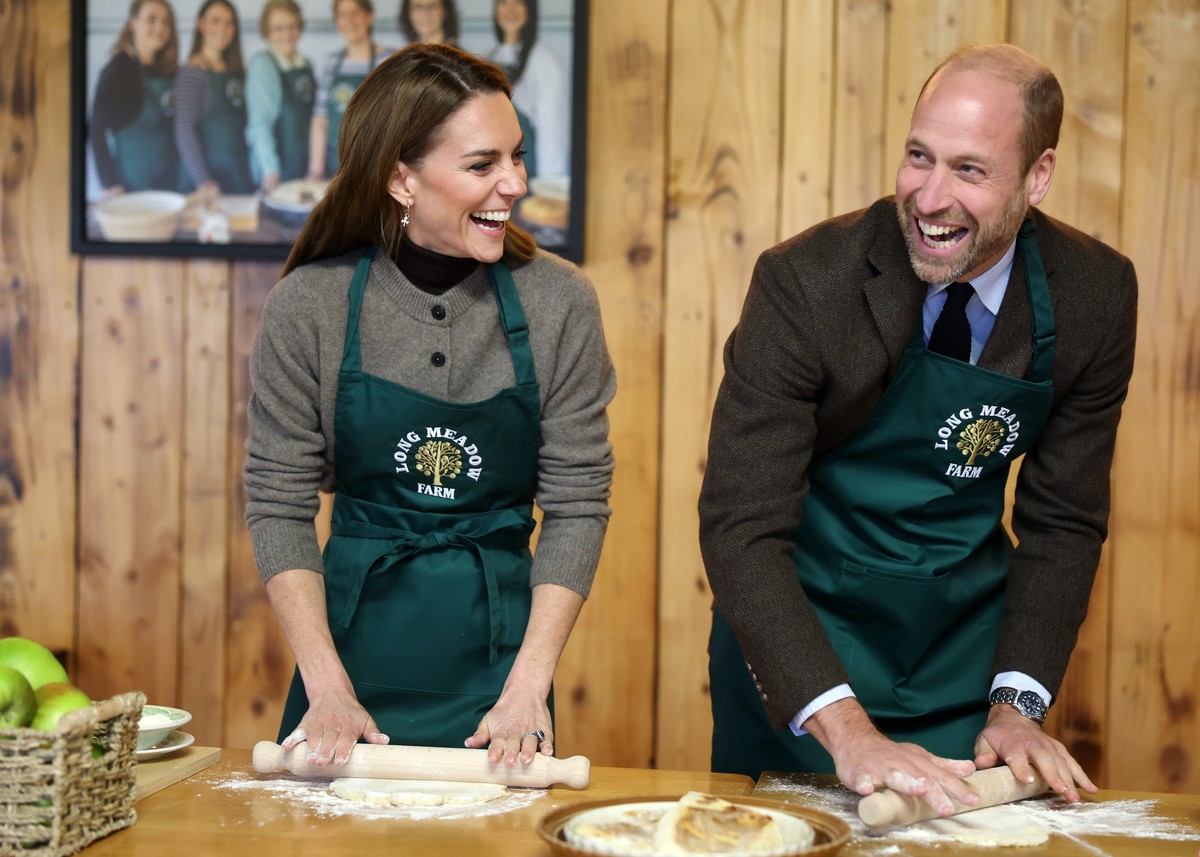 Britain's Prince William and Kate, Princess of Wales make a potato and apple cake during a visit to Long Meadow Cider in Craigavon, Northern Ireland, Tuesday, Oct. 14, 2025. (Chris Jackson/Pool P ...