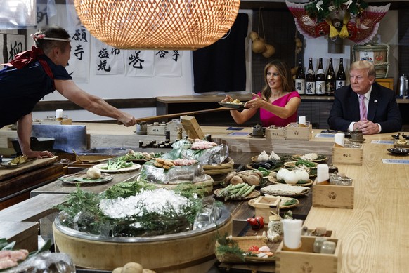 President Donald Trump and first lady Melania Trump have dinner with Japanese Prime Minister Shinzo Abe and his wife Akie Abe, Sunday, May 26, 2019, in Tokyo. (AP Photo/Evan Vucci)
