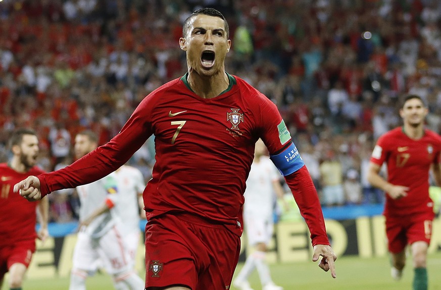 FILE - Portugal&#039;s Cristiano Ronaldo celebrates his side&#039;s opening goal during the group B match between Portugal and Spain at the 2018 soccer World Cup in the Fisht Stadium in Sochi, Russia, ...