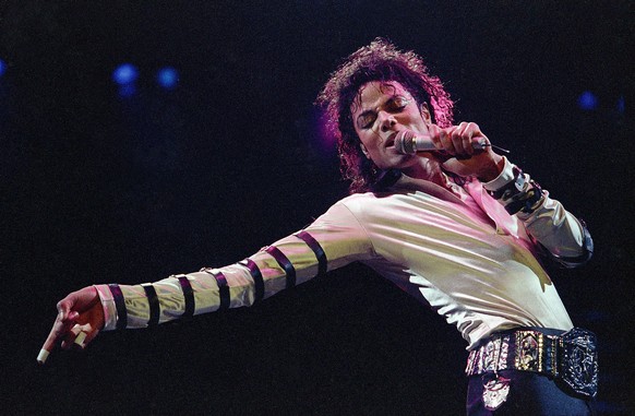 FILE - In this Feb. 24, 1988 file photo, Michael Jackson leans, points and sings, dances and struts during the opening performance of his 13-city U.S. tour, in Kansas City, Mo. Five years after Jackso ...